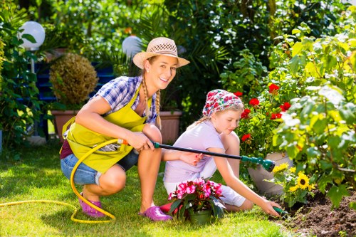 Technician performing risk assessment before hedge trimming